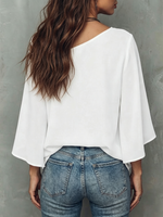 Loose-fit Top Featuring A Spliced asymmetrical Neckline, Abstract Line-art Face Graphic, Dropped Shoulders, And Flared Mid-length Sleeves