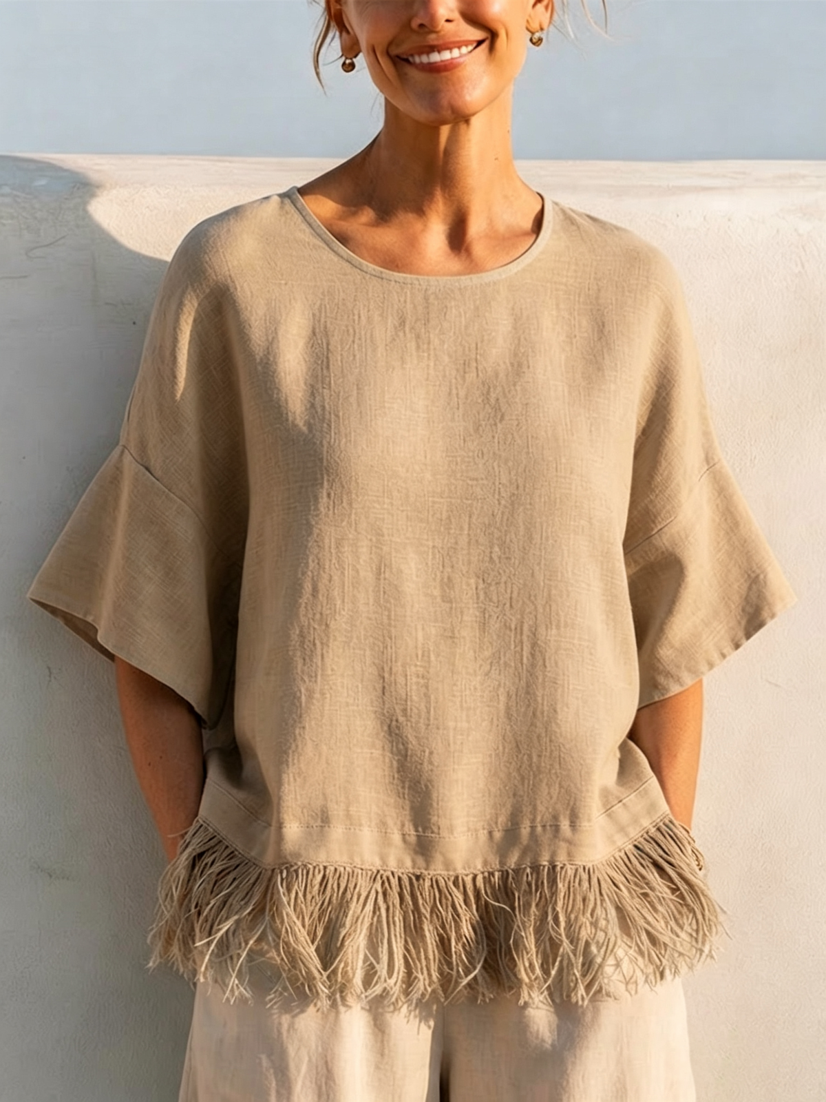Solid-color Washed Linen Loose-fit Top Featuring A Round Neck, Ruffled Mid-length Sleeves, And A Tassel Hem—designed For A Relaxed, Flattering Fit